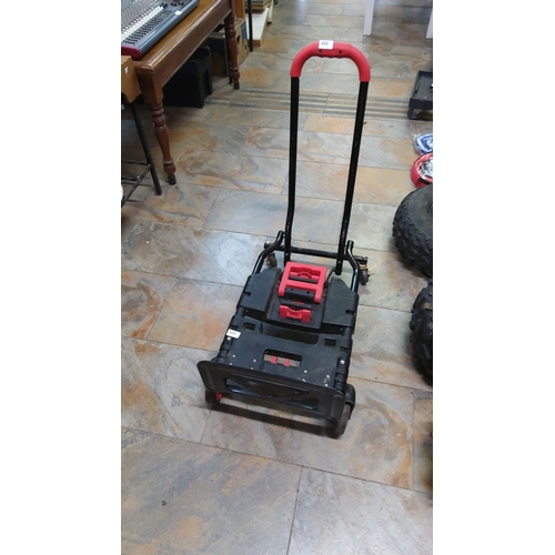 450 - Heavy-duty folding trolley with extendable handle, black plastic platform, and red accents. Features... 