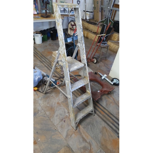 454 - Vintage aluminum step ladder with folding design and sturdy metal platform.