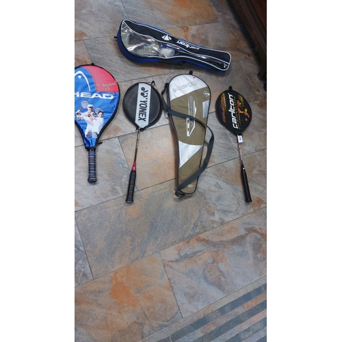 488 - Mixed lot of sports rackets, including tennis, badminton, and squash models from brands like Head, Y... 