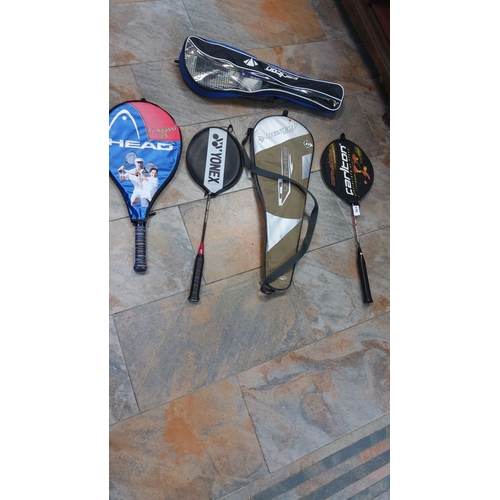 488 - Mixed lot of sports rackets, including tennis, badminton, and squash models from brands like Head, Y... 