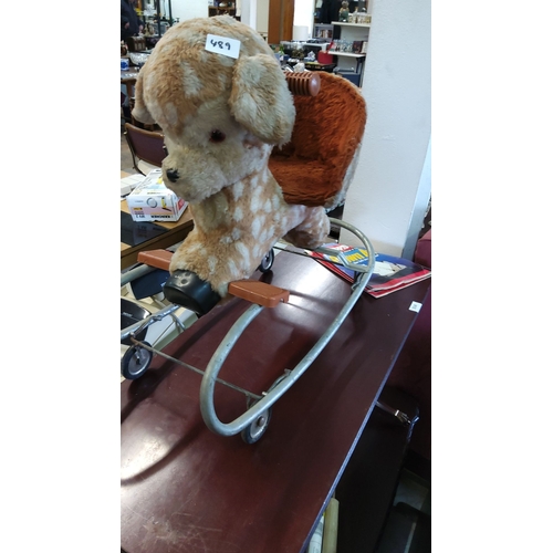 489 - Vintage plush 1960s rocking horse on a metal frame with rolling wheels, from the mid-20th century. F... 