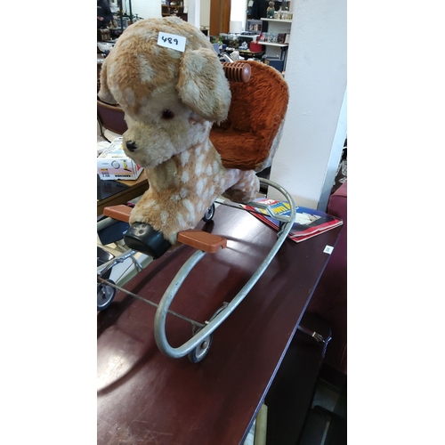 489 - Vintage plush 1960s rocking horse on a metal frame with rolling wheels, from the mid-20th century. F... 