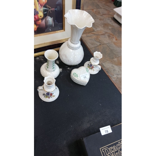 73 - Vintage ceramic lot includes a fluted vase, heart-shaped trinket box, candle holders, and bud vases.... 