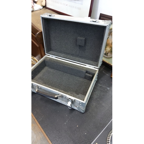 75 - Vintage aluminum equipment case with reinforced corners, foam interior, and secure latches.