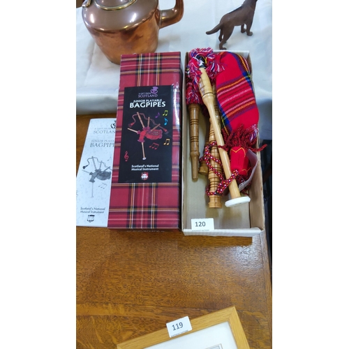 120 - Scottish Junior bagpipes feature a tartan cover and wooden drones, including the original box.