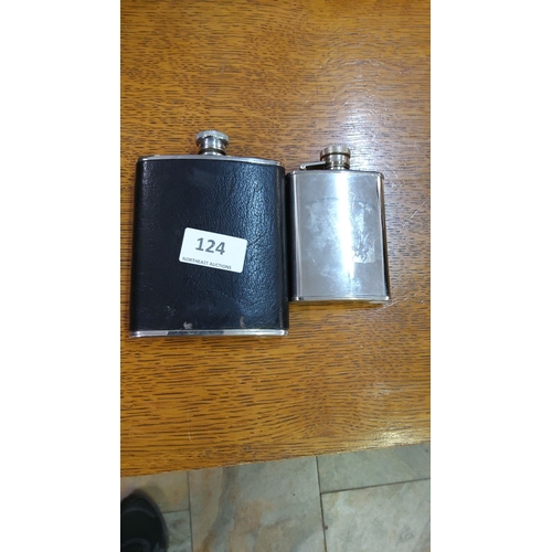 124 - Set of two vintage hip flasks, one leather-wrapped and one stainless steel with secure screw tops.