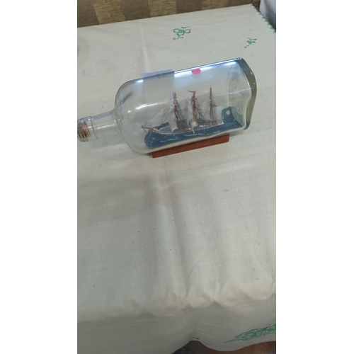 15 - Ship in a bottle, featuring a detailed three-masted sailing vessel on a wooden stand with intricate ... 