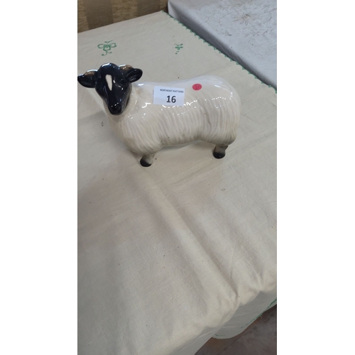 16 - Glazed ceramic sheep figurine with black and white detailing.