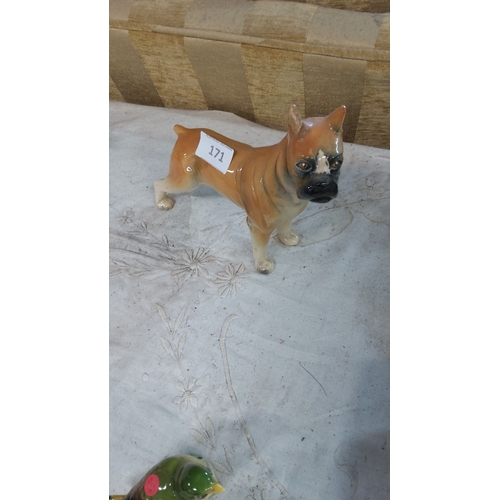 171 - Glazed ceramic figurine of a Boxer dog, detailed with a naturalistic finish.