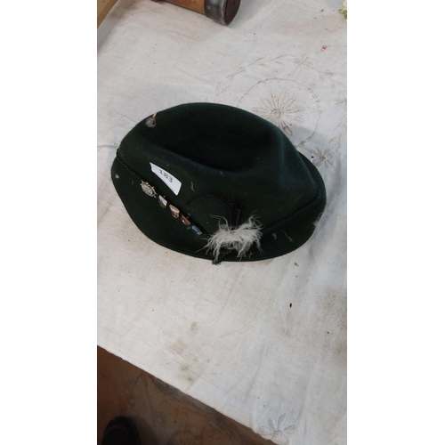 183 - Traditional German Trachten hat in dark green, featuring decorative pins and a feather accent.