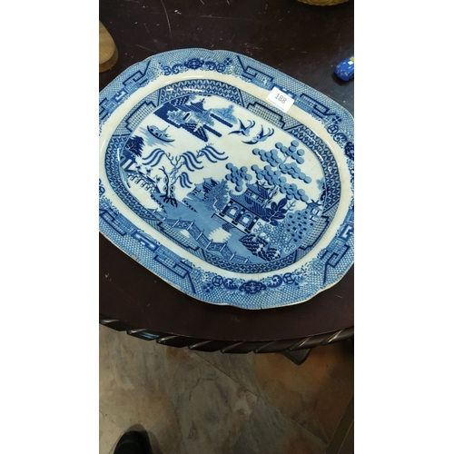 188 - Large 19th-century blue and white transferware platter in the classic Willow pattern, detailed with ... 