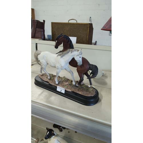 2 - Heavy Resin figurine depicts two galloping horses, finely detailed with lifelike movement, mounted o... 