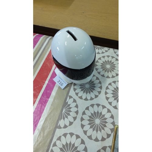 216 - Ceramic Stig helmet-shaped coin bank with a sleek white and black design.