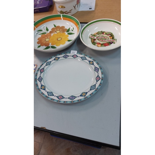 224 - Three-piece ceramic dinnerware set, including two decorative bowls with floral and vegetable motifs ... 