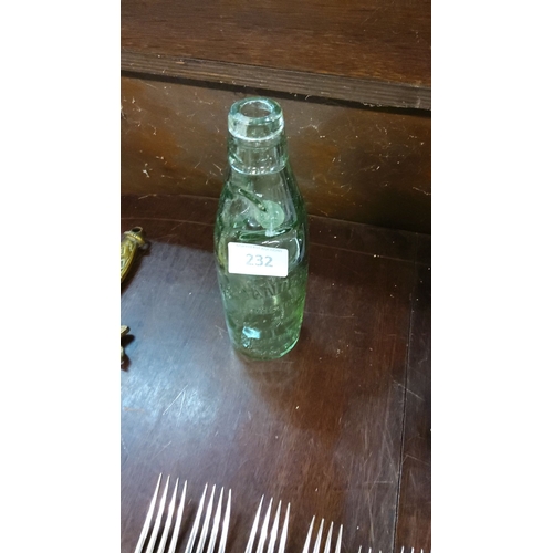 232 - Antique Codd-neck soda bottle, green-tinted glass with embossed lettering. Features an intact glass ... 