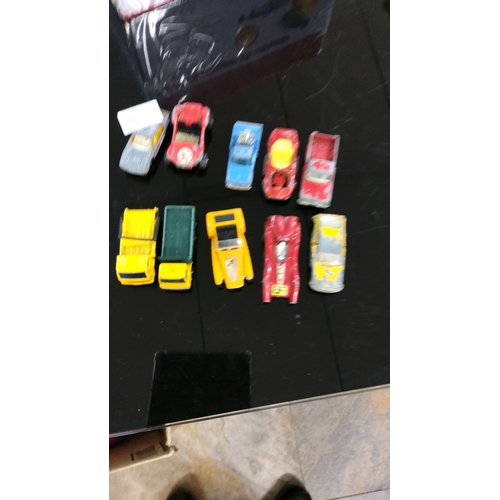 243 - 10 assorted vintage die-cast toy cars, including sports cars, trucks, and race cars.(some Matchbox)