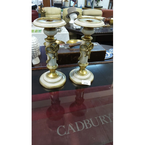 274 - Pair of 19th-century French wooden candlesticks, featuring neoclassical detailing with elegant drape... 