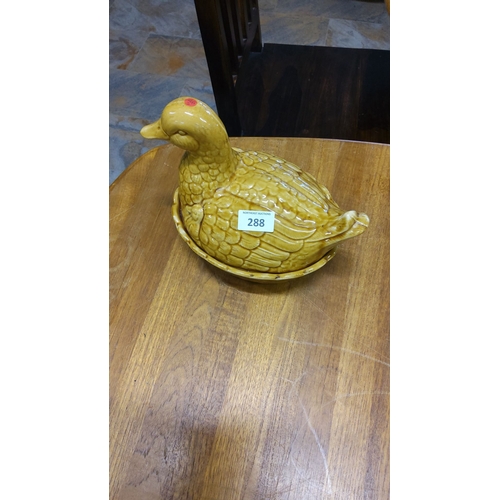 288 - Vintage yellow duck tureen with matching base. Glazed ceramic with textured feather detailing.