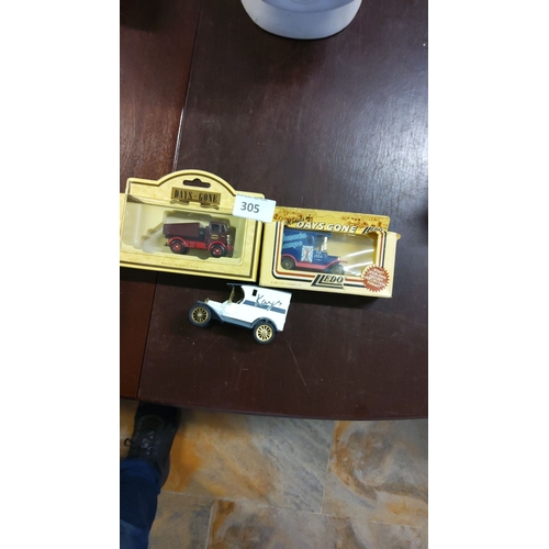 305 - Three diecast model vehicles: two boxed Lledo 