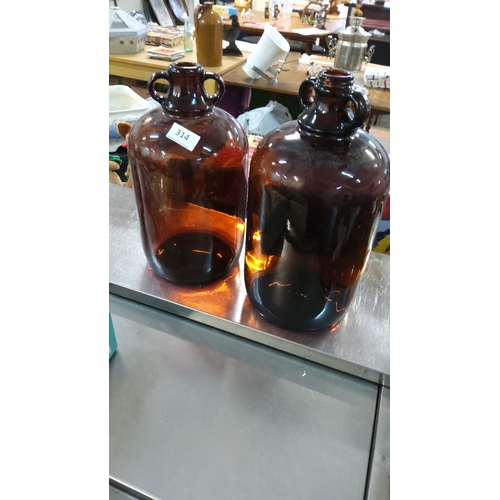 314 - Pair of vintag glass demijohn bottles with double-loop handles. Classic utilitarian design with rich... 