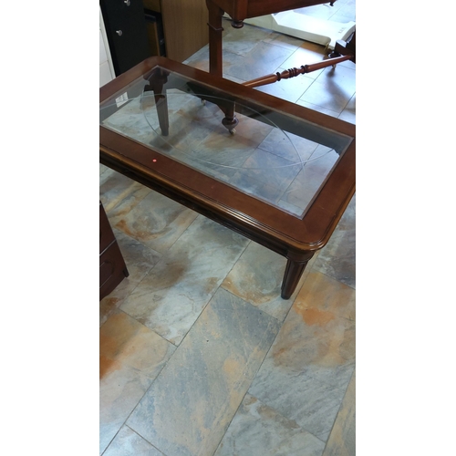 331 - Rectangular coffee table with a solid wood frame and beveled glass top. Features fluted legs.