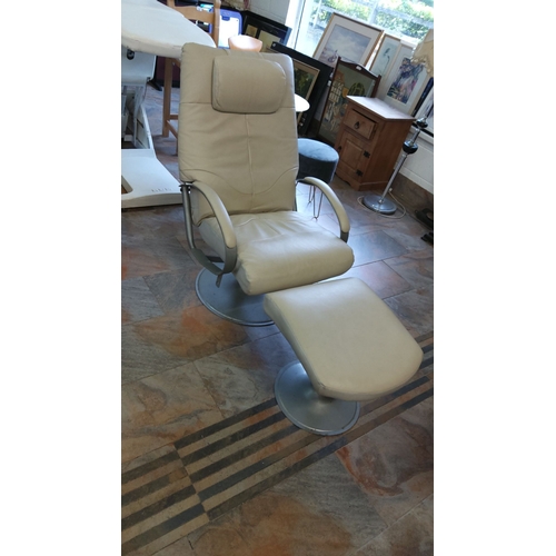 335 - Modern cream leather swivel chair with matching footstool. Features a sleek metal base and padded he... 