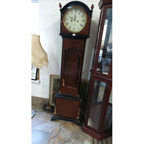 343 - Early 20th-century oak-cased grandfather clock with an arched dial, Roman numerals, and brass bezel.... 