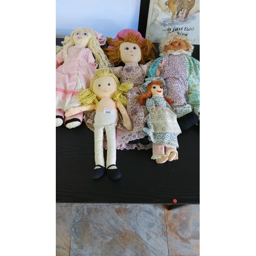 345 - This vintage handmade rag doll collection includes five fabric dolls with embroidered faces and yarn... 