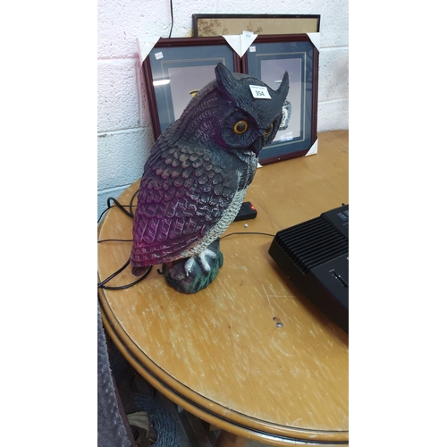 354 - Painted resin owl decoy features lifelike detailing and glass eyes.