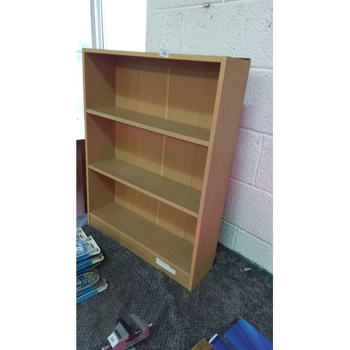 358 - Wooden bookshelf with three fixed shelves and a light wood finish.