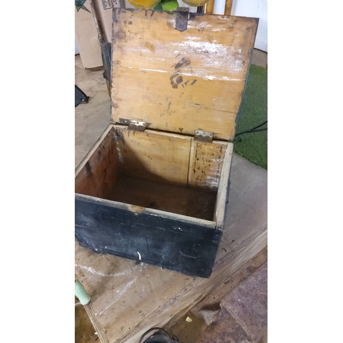 410 - Rustic wooden storage chest with black exterior, metal latch, and hinged lid.