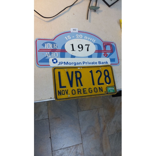 442 - Tour Auto rally plate and 1990 Oregon license plate. Featuring vintage automotive memorabilia.