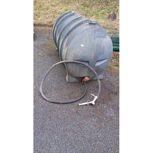 464 - Large plastic fuel storage tank with dispensing hose and nozzle. Sturdy construction.(1100 litres)