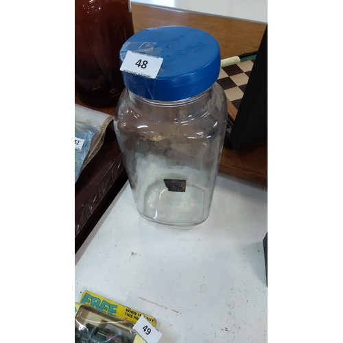 48 - Large vintage glass sweetie jar with a blue plastic screw-top lid.