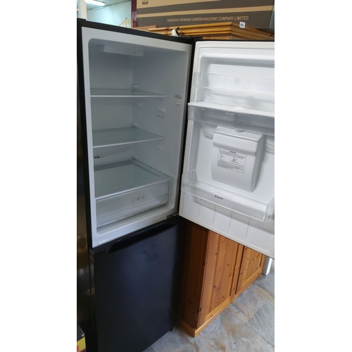 492 - Black freestanding refrigerator-freezer with water dispenser. Features spacious interior with glass ... 