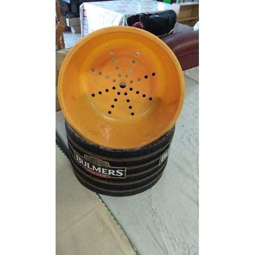 6 - Black exterior barrel-style plastic ice bucket with gold bands and a yellow perforated interior.