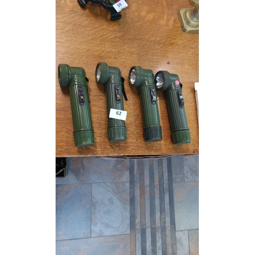 62 - Set of four vintage military-style angle head flashlights, olive green plastic bodies with belt clip... 