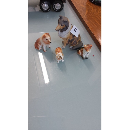 65 - Four vintage porcelain dog figurines, including Collie and Shetland Sheepdog breeds, hand-painted wi... 