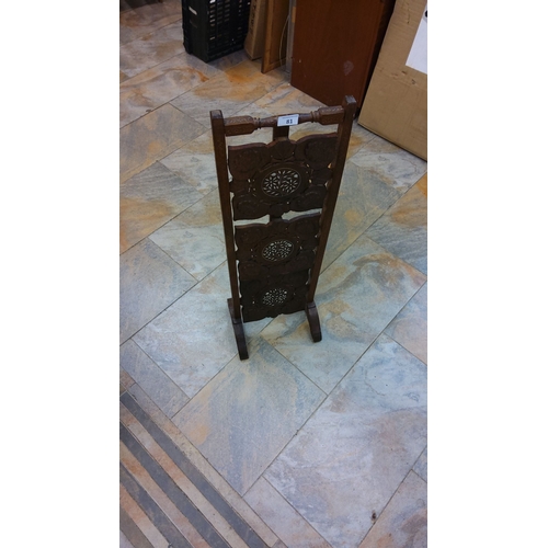 81 - Antique folding wooden whatnot stand with intricate floral carvings and inlaid decorative panels. Fr... 