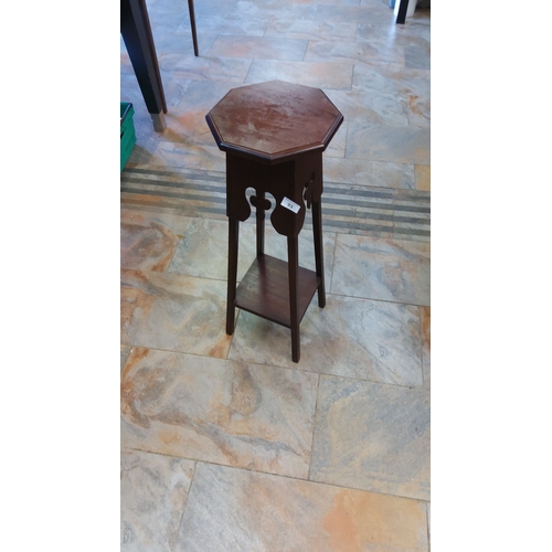 93 - Vintage wooden octagonal side table with pierced apron details and lower shelf. Rich dark wood finis... 