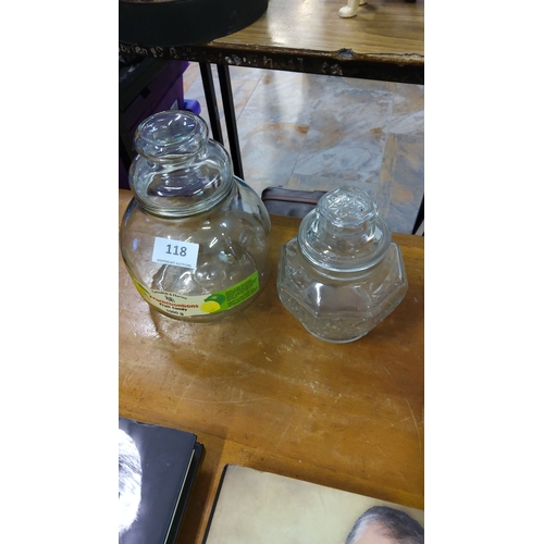 118 - Pair of vintage glass sweet jars with lids, including a large round jar and a smaller faceted jar wi... 