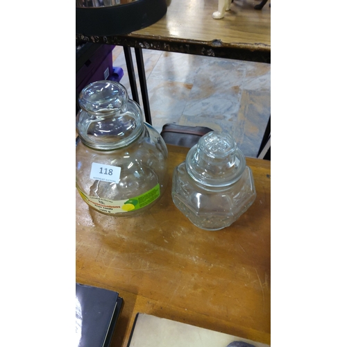 118 - Pair of vintage glass sweet jars with lids, including a large round jar and a smaller faceted jar wi... 