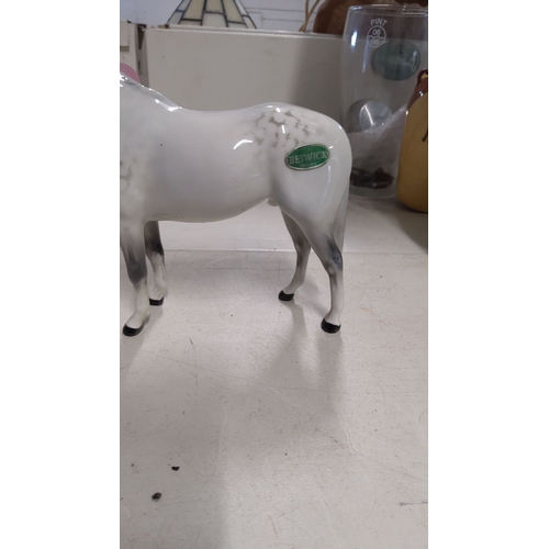 129 - Beswick porcelain horse figurine, hand-painted in a dapple grey finish. From the renowned English po... 