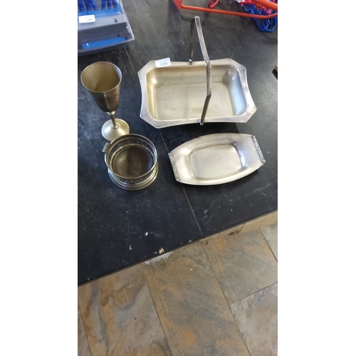 149 - Silver-plated tableware set, including a serving tray with handles, a goblet, a bottle coaster, and ... 