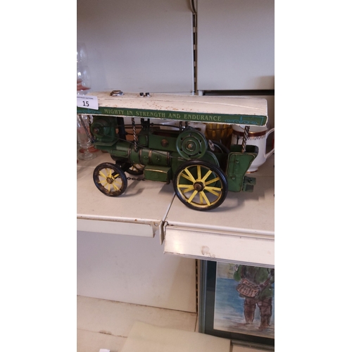 15 - Vintage tinplate model traction engine with canopy, featuring 