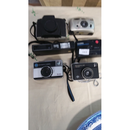 163 - Lot of six vintage cameras, including Kodak Instamatic 155X, Agfamatic 200 Sensor, Halina Panorama, ... 