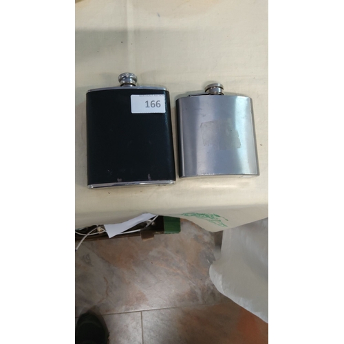 166 - Pair of vintage stainless steel hip flasks, one with a black leather-wrapped exterior. Both feature ... 