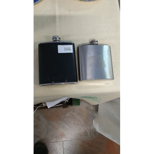 166 - Pair of vintage stainless steel hip flasks, one with a black leather-wrapped exterior. Both feature ... 