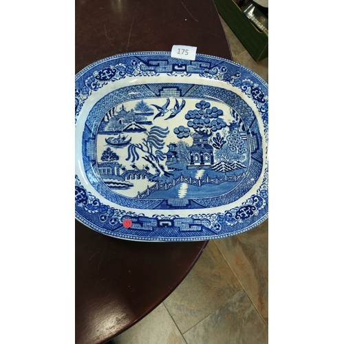 175 - Blue and white transferware platter featuring the classic Willow pattern, from the early to mid-20th... 