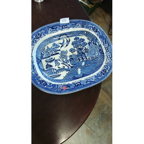 175 - Blue and white transferware platter featuring the classic Willow pattern, from the early to mid-20th... 